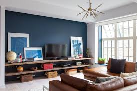 Audrey S Cozy Industrial Soho Apartment Blue Accent Wall Living Room Feature Wall Living Room Accent Walls In Living Room
