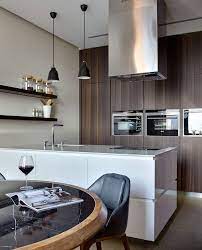 cuisine moderne ilot de cuisine blanc laque table ronde en bois et chaises en cuir noir cuisine moderne ilot de cuisine blanc cuisine blanc laque