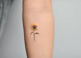 Small Sunflower Nature Tattoo This Minimalist Tattoo Is So Cheerful And Cute The Sunflower Is Small Nature Tattoos Sunflower Tattoos Sunflower Tattoo Small
