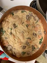 Homemade Alfredo Sauce And Noodles With Fish Shrimp Mushrooms And Spinach Food