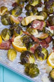 On a large rimmed baking sheet, toss the brussels sprouts, pancetta, wine, lemon, shallots, garlic, sage and the remaining 2 tbsp. Lemon Bacon Roasted Brussels Sprouts The Kitchen Magpie