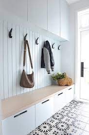 The mudroom unit is painted behr marquee cameo white, which is the same white we used for the kitchen island, the board where can i find your beautiful black chandelier: Adding Black Iron Hooks On A White Mudroom Plank Wall Creates A Stylish And Functional Addition To A Gray Wash And Mudroom Decor Hallway Storage House Interior