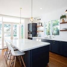 White Upper Cabinets And Navy Lower Cabinets With Long Brushed Brass Pulls Transitiona Navy Blue Kitchen Cabinets Contemporary Kitchen Kitchen Cabinet Design