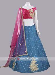 Find your perfect shade from a palette of vivid skies, elegant pastels, royal blues, and enigmatic dark tones. Deep Pink And Peacock Blue Lehenga Suit