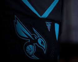 The buzz city alternate features black base color with teal and white typography. Charlotte Hornets Buzz City Unis Uniswag