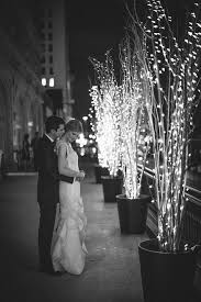 15 Ways To Decorate Your Wedding With Twinkle Lights Rooftop Wedding Wedding Lights Wedding Branches