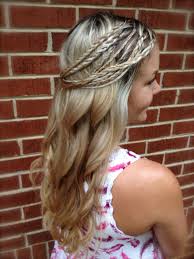 Two tiny braids are the centerpiece of a wavy hairstyle decorate them with a couple flowered beads for flower child vibes. Wedding Hairstyles Wedding Hippie Hairstyles