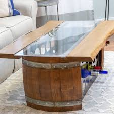 Handcrafted from wrought iron and acacia wood, this piece has a modern yet rustic feel. Wine Barrel Bottle Storage Coffee Table Wine Country Accents