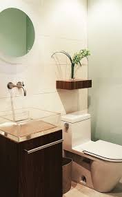 A dark shelf and nautical decor add elegance to a bright bathroom. Photo Gallery 20 Small Bathrooms Bathroom Ideas Powder Room Design Modern Powder Rooms Kid Bathroom Decor