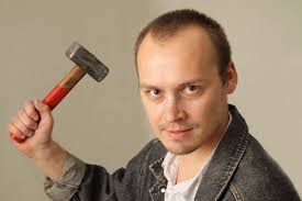 Funny Crazy Guy with a Hammer Stock Image