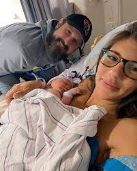 The only yellow and green were fans of! 🚜 💜💛 Hadleys first visit to the  farm! @bennytrainer1 @lori.morrison.520 #givemesomemorrisonofthat  #johndeerebaby #farmlife