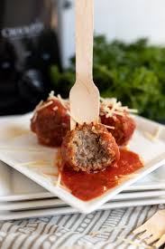 Add sausage to the bread crumb mixture; Slow Cooker Italian Sausage Meatballs Crock Pot Party Appetizer