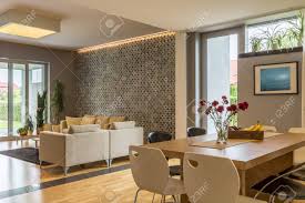The compilation of neutral shades feels very friendly, tender and hospitable the harmony of wooden and beige elements in this modern living room blows us away. Modern House In Beige With Living Room And Dining Area Combined Stock Photo Picture And Royalty Free Image Image 62765076
