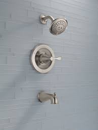 Pale Blue Bathroom Tile Pairs Well With A Brushed Nickel Shower Head From The Delta Faucet Porter Colle Tile Bathroom Bathroom Shower Faucets Bathrooms Remodel