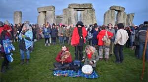 People take part in winter solstice celebrations at the ancient stonehenge monument in wiltshire. Winter Solstice Thousands Gather At Stonehenge At Dawn Bbc News