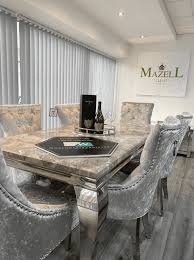 Finished to the highest standard with a buttoned back, studded detailing, and curved back this stunning piece incorporates both style and comfort. Elouise Marble Dining Set W Rio Silver Knocker Back Chairs