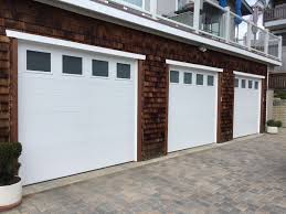 Clopay Modern Groove 3 Car Single Garage Doors With Frosted Glass Looks Groovy Garage Door Styles Garage Door Types Garage Doors