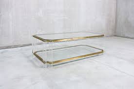 Acrylic coffee tables appreciated for their style and the ability to appear in any room, in spite of its lightness and airiness. Vintage Italian Brass And Acrylic Coffee Table 1970s For Sale At Pamono
