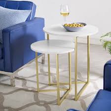 Marble coffee tables can be either genuine marble or made from a faux marbleising look so there's something for every budget, and they come in round marble coffee tables look exceptionally chic regardless of whether they're imitation or genuine marble. 2 Piece V Leg Nesting Side Tables In White Faux Marble Gold Walker Edison Afvicnstmw