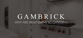 Cream colored kitchen cabinets with marble solid stone slab backsplash. Why Are Wolf Ovens So Expensive And Are They Worth It
