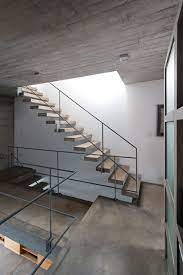 Luciano Kruk And Maria Victoria Besonias Squeeze Two Concrete Homes Onto A Narrow City Plot Interior Stairs Staircase Design Stairs Design