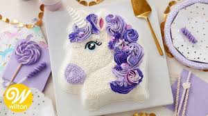 While holding the cooling rack and the cake board together, flip the two over to get the cake onto the cake board. How To Make A Purple Buttercream Unicorn Birthday Cake Wilton Youtube