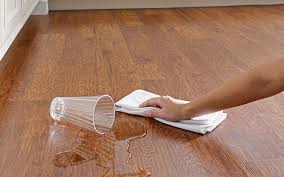 Someone Easily Wiping Up A Water Spill With A Towel On An Easy Care Vinyl Floor Vinyl Flooring Vinyl Plank Flooring Best Vinyl Flooring