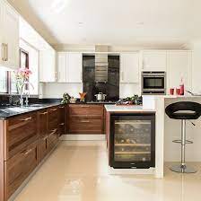 White cabinets also pair well with many popular styles, including farmhouse kitchen designs. Walnut And White Kitchen Kitchen Decorating Ideal Home White Modern Kitchen Walnut Kitchen Walnut Kitchen Cabinets