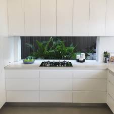 Caesarstone Australia On Instagram Clever Planting Combined With A Window Splashback Adds Space Light A Concrete Kitchen Home Decor Kitchen Kitchen Interior