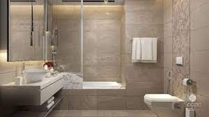 The bathtub of volcanic limestone and resin is by victoria + albert, and a ladder shelf keeps towels at a hand's reach. Apartment Bathroom Design Spazio