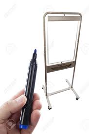 Blue Flip Chart Pen Held Up In Front Of A Flip Chart Combined