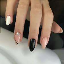 If you are one of those edgy girls and you love wearing dark colors and having your nails painted dark, or you just want a change in the color of your nails and want to switch it up a bit, then this is for you. Delicate Nail Design Nude Black And White Nail Art Designs