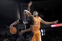 Trevon Evans, left, of Hallsville High School plays tight defense as Zay  Wilson, right, of Tolton High School brings the ball up the court