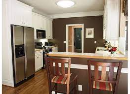 Here, crisp green walls mingle with bright red accessories and white cabinetry. What Color Is Your Kitchen Weddingbee Brown Walls Kitchen Brown Kitchens Kitchen Wall