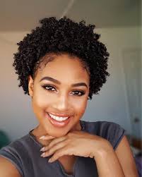 Braided half up hairstyle for short hair. Coily Pulled Back Puff Perfect Coily Corkscrews Are Pulled Back Into A Large Puff Look Crea Short Natural Hair Styles Natural Hair Styles Curly Hair Styles