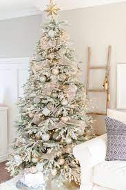 A Snowy Flocked Christmas Tree Nick Alicia White Christmas Trees Christmas Tree Design White Christmas Decor