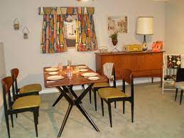You can take your dining experience to the next level with interesting accent pieces, like bar carts and side consoles, that are sure to be the center of conversation. 1950 S Dining Room 1950s Dining Room Mcm Dining Room 50s Interior