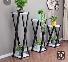 This vase can stand on its own as an accent piece without adding flowers to it as well. Flower Pot Stand Designed By Asmak Sai Interior Design Facebook