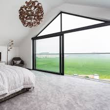 Complete master bedrooms have a sitting area, like the one pictured here. Modern Master Bedroom With Large Open Window Bedroom With White Walls And Dark Grey Windows White Wall Bedroom Modern Master Bedroom Contemporary House Design