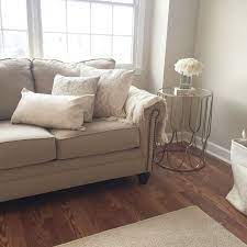 Cozy Living Room Warm Beige And Whites Paint Color Calico Cream Sherwin Williams Milari Sofa In Beige Couch Living Room Living Room Warm Living Room Colors
