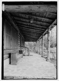 19. Transverse view through porch of the log house looking from west to  east