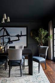 Dining room walls in stiffkey blue no. A Dark Brown Modern Dining Table Sits On A Gray And Blue Rug Surrounded By Gray And Blue Dining Chairs A Blue Dining Chair Modern Dining Room Dark Brown Table