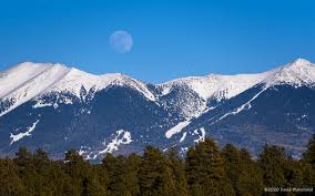 Winds w at 10 to 20 mph. Moon Rise Above San Francisco Peaks Flagstaff Altitudes