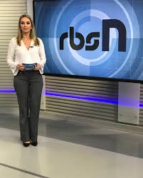 She is a celebrity news anchor. Carla Fachim