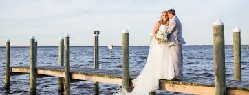 Wedding officiate, two post bamboo arbor with custom color material, wedding photographer, sand ceremony and prerecorded music. Destin Bay House Destin Fl Wedding And Event Venue Bay Beach Weddings