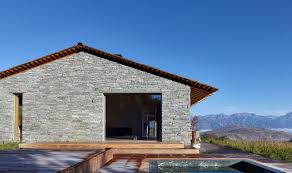 This charming stone cottage celebrates a glass and stone combination. Photo 9 Of 11 In This Modern Stone Cabin Looks Like It Belongs In Middle Earth Dwell