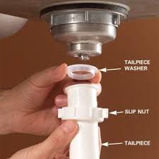 Installing kitchen sink strainer basket and drain pipe. How To Replace A Kitchen Sink Basket And Old Metal Trap Diy Family Handyman