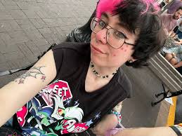 just wanted to show off my angel dust tattoo & the angel tank i wore to a  pride event 🩷🩷🫶