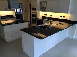 Having gloss white cabinets installed with a matt black worktop creates a beautiful contrast not only between colours but textures as well. Choosing A Countertop To Match White Units Granite Line