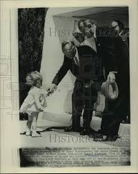 1961 Press Photo 16-month-old Gina Klein gives flowers to Konrad  Adenauer-Texas